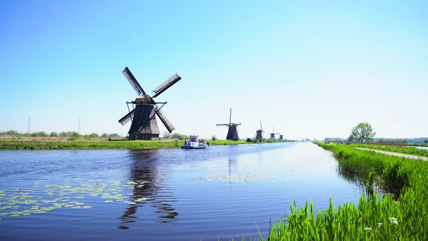 dutch windmill over river waters