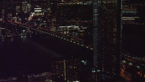 Aerial view of the Brooklyn Bridge leading to downtown Manhattan, New York, at night during winter. Shot on 4k RED camera
