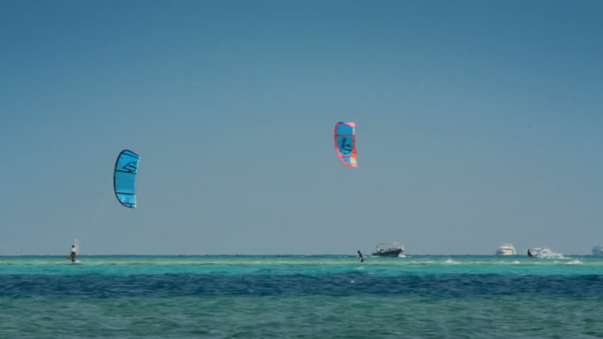 kite surfing - surfers on blue sea surface - timelapse