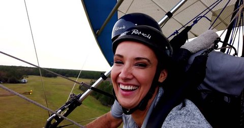 Orlando, Florida / United States - September 26, 2018: Close Up of Faces as Couple Hang Glides Through Sky, Gopro