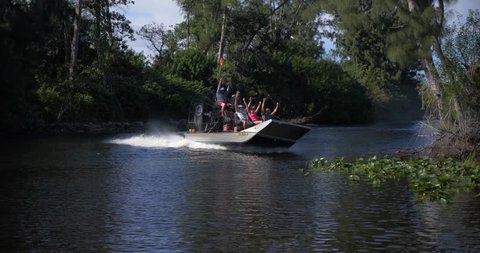 Everglades, Florida / United States - September 27, 2018: Tourists on Airboat Excursion, Everglades Swamp Slow Motion
