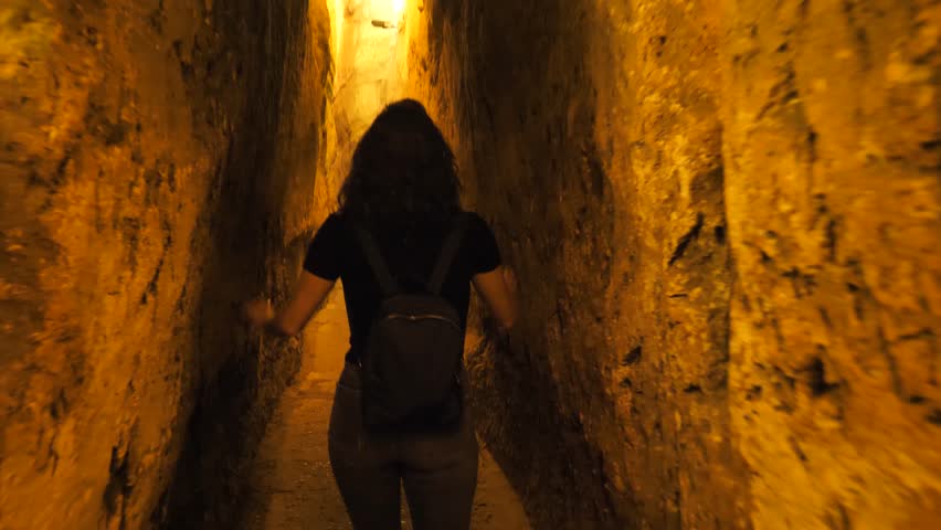 Following young female tourist in Western Wall tunnels, Jerusalem