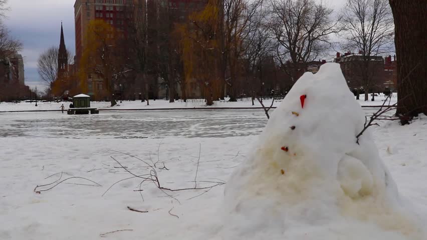 Melting snowman sitting in the Boston Common