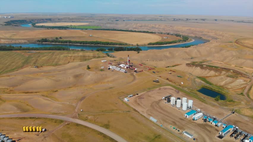 4k Aerial: oil drilling rig in Alberta Canada