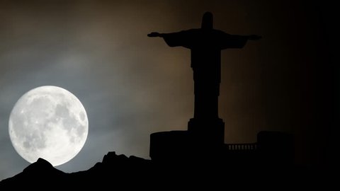 Rio de Janeiro, August 2014: Christ the Redeemer Landmark Monument on Corcovado, Night with Full Moon, South America, Brazil
