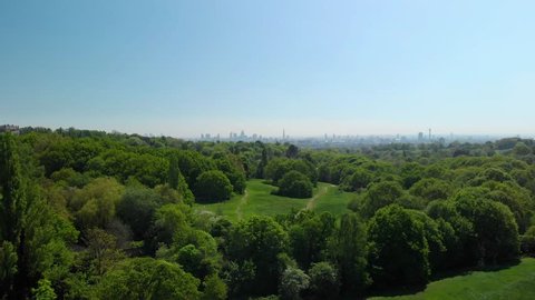 london skyline reveal over hampstead heath park aerial view sunny blue sky day summer