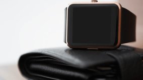 Footage of modern smart watches with empty black screen.Place mobile app logo, text on touchscreen device panel.Stay always connected to internet & social media using trendy mobile applications