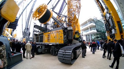 munich, germany, 08 april 2019, bauma, world's biggest exhibition for construction equipment, liebherr exhibition, slow motion video

