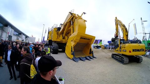 munich, germany, 08 april 2019, bauma, world's biggest exhibition for construction equipment, komatus exhibition, slow motion video
