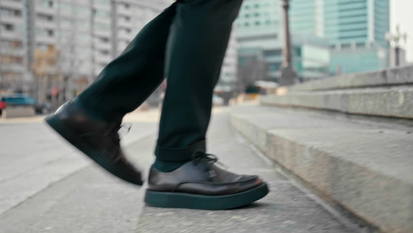 Close Up 4K Slow Motion Shot of Office Worker Man Walking Upstairs Outdoors in City. Male Feet in Suit and Platform Shoes Making Steps to Climb Up the Stairs