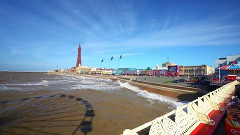 Blackpool - Lancashire - 26th March 2019 The world famous Blackpool Tower and beach surrounded by hotels, pubs and seaside on a Summers day at one of Great Britains most popular holiday destinations