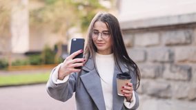 Beautiful woman having video chat using smartphone