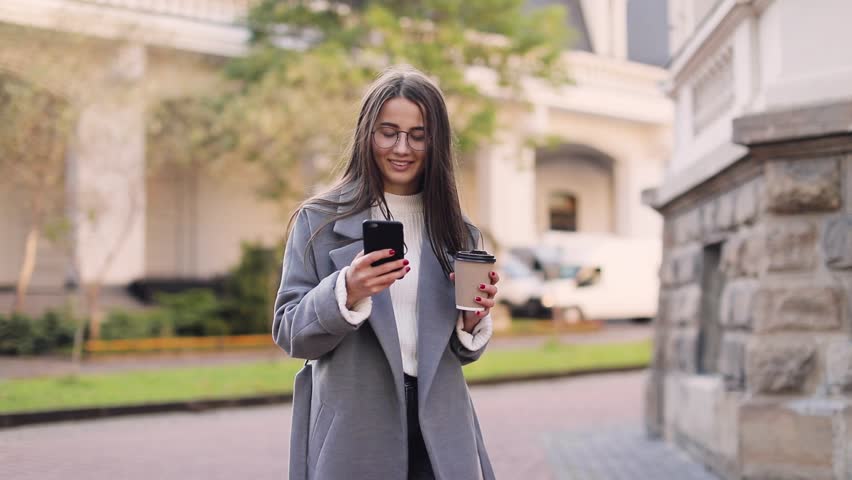 Young woman texting or using smartphone