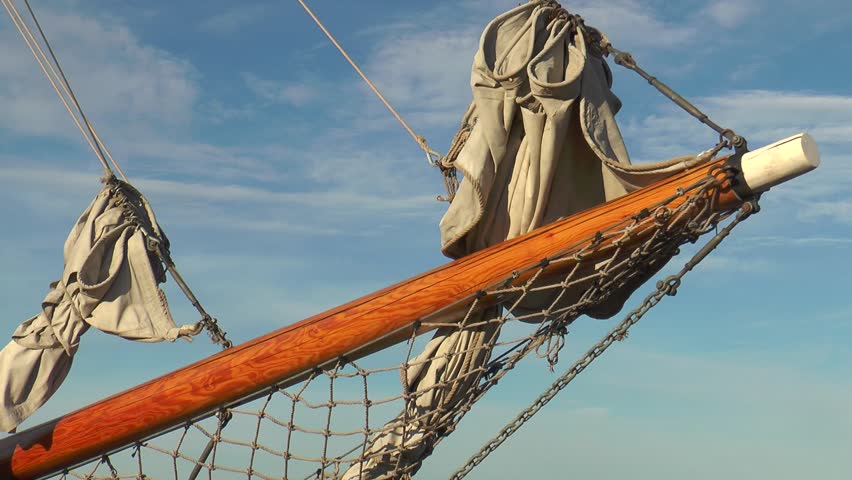 Helsinki, Finland. Sailing schooner at the pier, schooner bowsprit.
  Warm summer evening.

