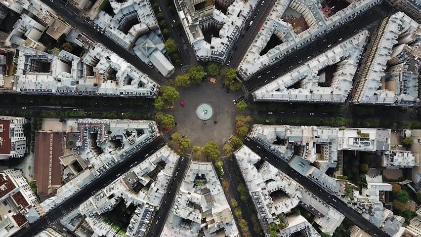 Aerial, screwdriver, drone shot, of streets, in the cityscape of Paris, on a sunny, summer day, in France