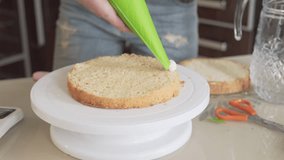 Close up video of a woman making a cake