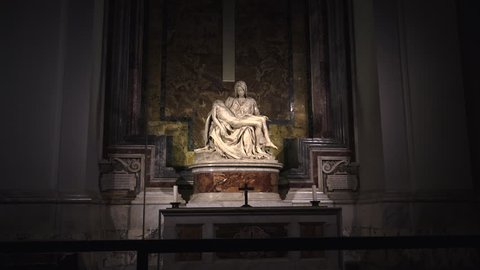 VATICAN,Rome - 2019: Tourists at the sculpture Pieta ( Michelangelo ) inside St. Peter's Basilica in Vatican;