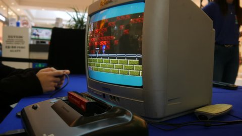 SZEKESFEHERVAR, HUNGARY - MARCH 16, 2019: View on a retro game console game played on an old tv in a game exhibition event in Alba Plaza, Szekesfehervar, Hungary