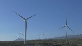 Ungraded: Wind turbines with rotating blades on Tenerife, Canary Islands. Ungraded H.264 from camera without re-encoding.