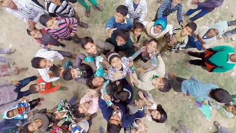 VARANASI, INDIA. Julay 2017. Top aerial shot of the boys smiling while look directly into the camera. Kids having fun and enjoy the company of each other.