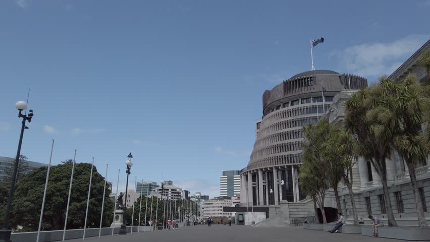 New Zealand flag flying over government buildings in Wellington City. 4k