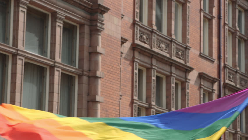 Waving Flag at LGBTQ, Lesbian, Gay, Bisexual, Transgendered, Queer, Pride Parade Street Party Celebration Marching in slow motion Close Up Royalty-Free Stock Footage #1027271351