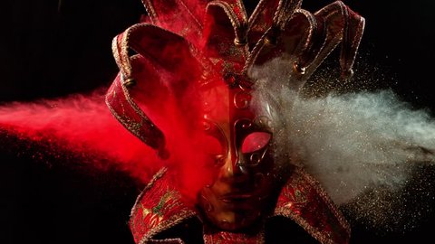 Super Slowmotion Shot of Color Powder Explosion and Venice Mask