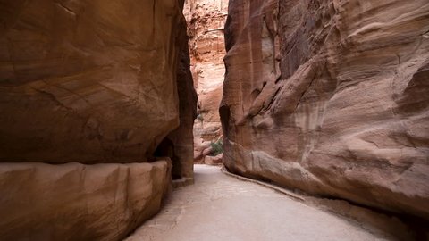 Walking Inside the Al Siq Canyon Towards The Treasury in Ancient City of Petra