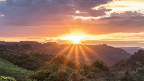 Beautiful sunrise over wild forest mountains in summer morning in New Zealand nature Time lapse