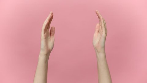 Woman hands arms clapping applause bravo showing two ok okay gesture isolated over pastel pink background in studio. Copy space for advertisement. With place for text or image Advertising area mock up