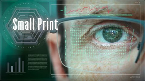 A close up of a businessman eye controlling a futuristic computer system with a Small Print Business concept.