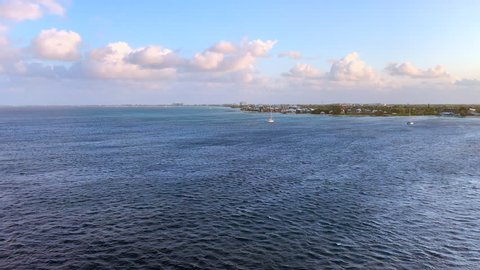 Pan across Grand Cayman Island from a ship on the ocean
