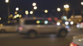 Cars waiting for turn on the busy street in night