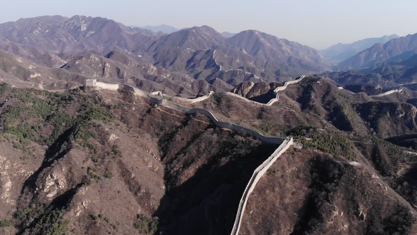 Impressive aerial panorama of Great Wall of China, long fortification line run over mountains. Reconstructed section, Badaling site, popular tourist attraction