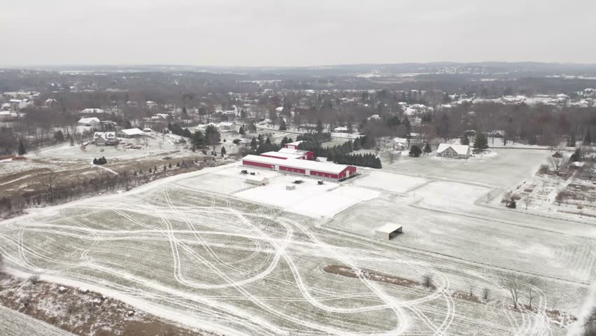 Winter aerial of red barn in Wisconsin