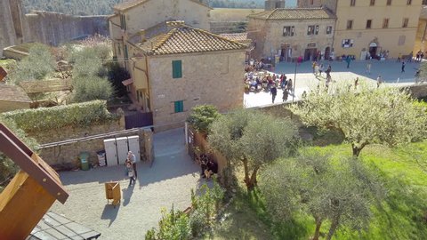 Monteriggioni Siena, IT - Mar 2019: Panning gimbal main square of the medieval village within the defensive walls - Tuscany; architecturally significant, referenced in Dante Alighieri's Divine Comedy
