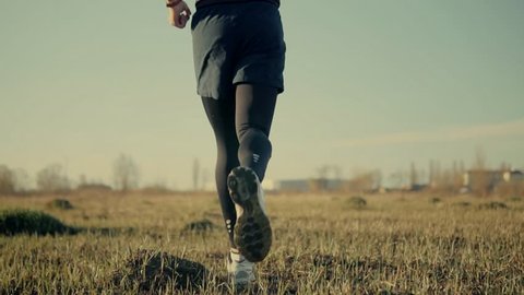 Running Man Cardio Fitness Training.Marathon Runner Sport Jog.Workout Sport Recreation. Runner Fit Athlete Legs Jogging.Triathlete Running,Sprinting On Endurance Marathon Workout Triathlon Competition