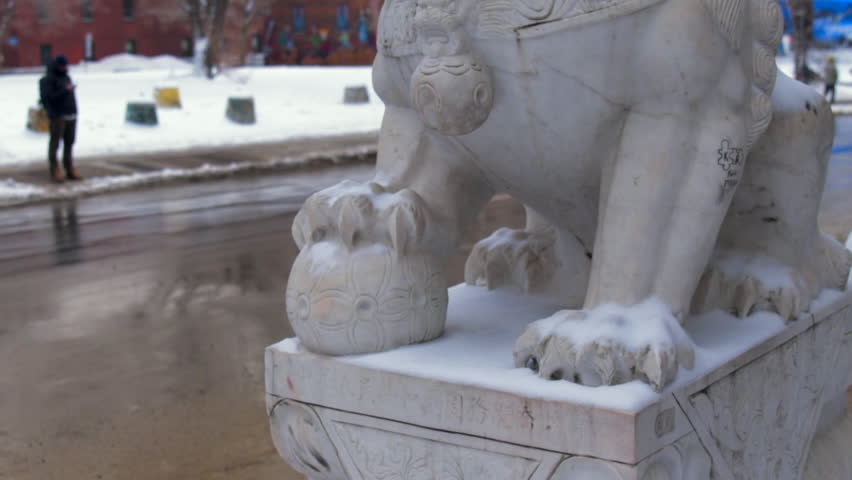 Cinematic roll up b-roll footage of chinese lion in Chinatown - winter season.