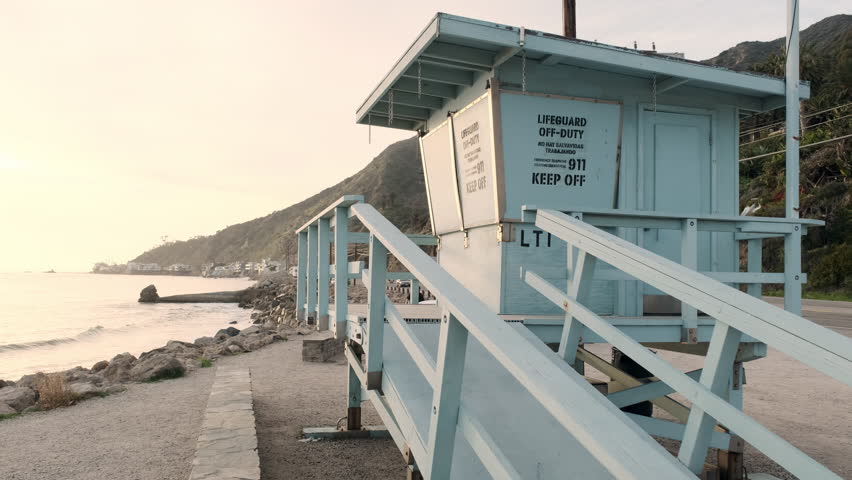 Aesthetic sky blue lifeguard station on the shoreline of Big Rock beach of Malibu California