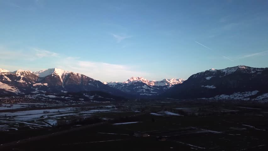 Beautiful wide open landscape view over big snowy swiss mountain.