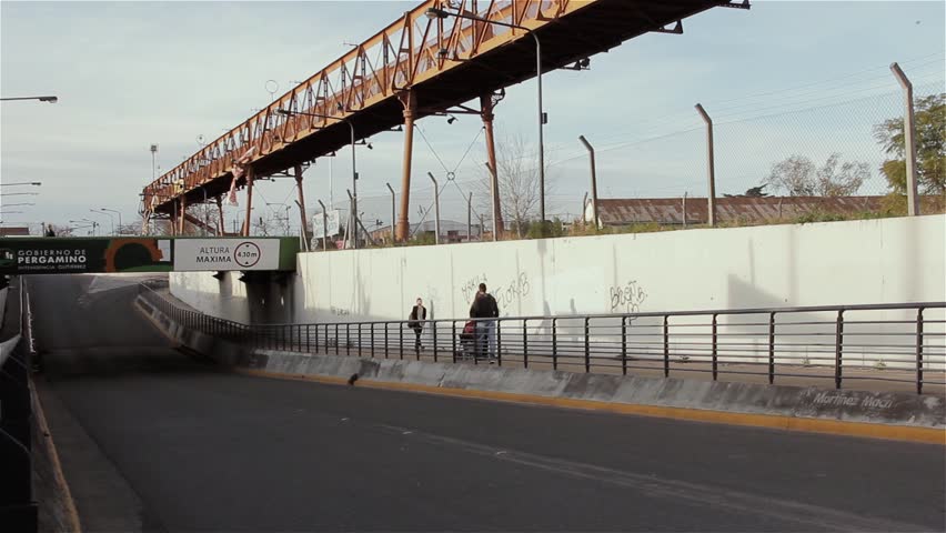 Pedestrians and Bicycle Passing Through Urban Underpass, Pergamino, Buenos Aires Province, Argentina