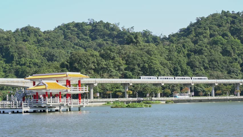 Nature scene with metro railway around Dahu Park at Taipei, Taiwan Royalty-Free Stock Footage #1027399145