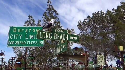 Oro Grande, CA / USA – April 8, 2019: Located on historic Route 66 north of Ore Grande, Elmer's Bottle Tree Ranch is a unique collect of glass bottles and vintage items displayed on metal poles.