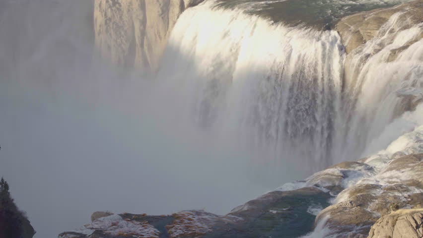 Sunlight Illuminating The Top Of Dramatic Shoshone Falls, Idaho.