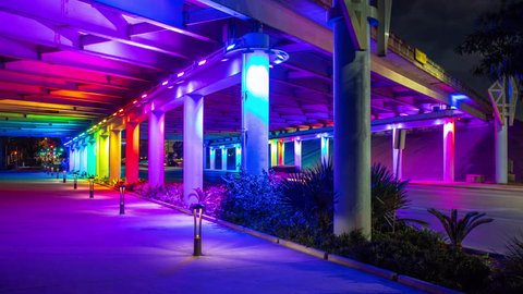 Vibrant San Antonio TX Downtown Street Scene with Colorful LED Light Channels Moving Lighting onto an Underpass Architecture
