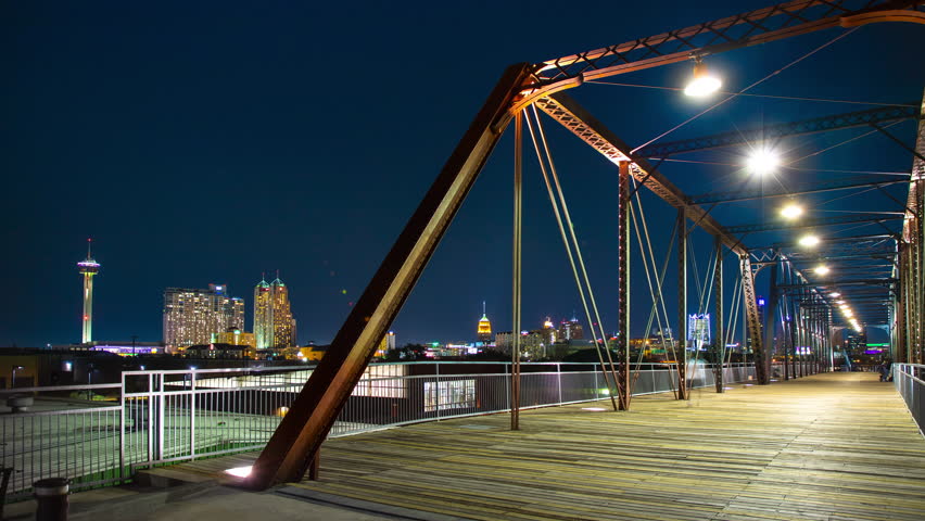 San Antonio TX Vibrant Cityscape Timelapse from Hays Street Bridge with Generic People Visiting the Texas Landmark at Night