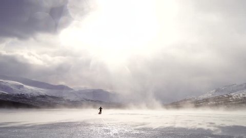 High winds while cross-country skiing over a frozen river in Sarek. Lapland, Sweden.