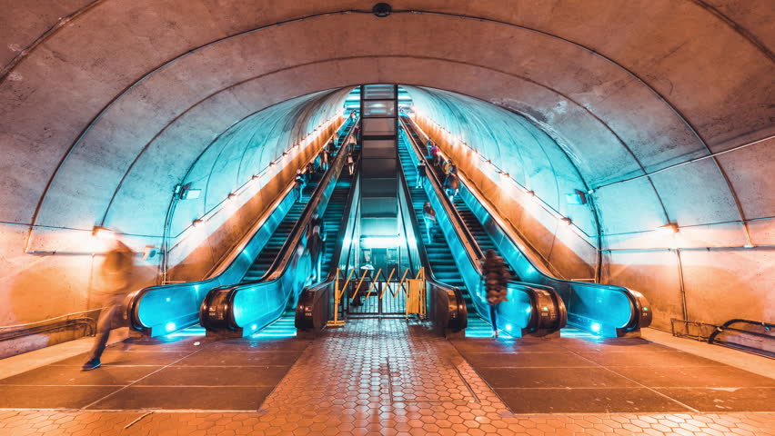 4K UHD Time-lapse of unidentified people walking and using escalator at underground subway station in Washington, USA. Public transportation, American city life, or America commuter lifestyle concept