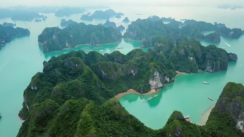 Helicopter Ha Long Bay  Exotic sharp rocks in blue sea. Cruise ships boats Beautiful seascape horizon. Site popular travel destination Vietnam unesco. Drone drift
