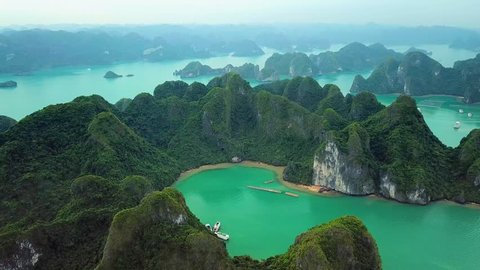 Helicopter tropical Ha Long Bay lot sharp natural rocks sea blue azure water. Wild natural untouched seascape horizon. Famous popular travel sight. Best Asia Vietnam. Drone
